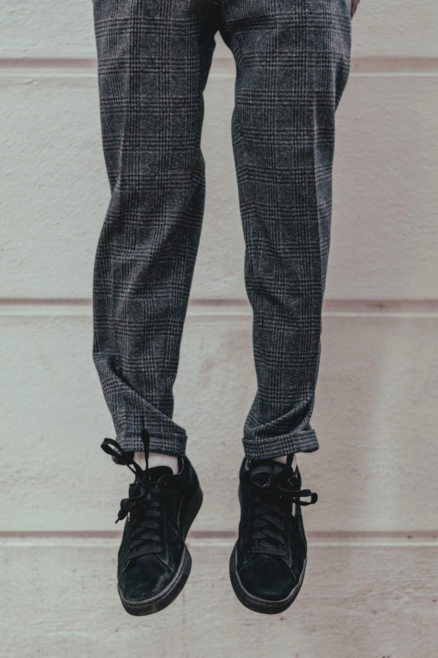 Black sneakers and trousers