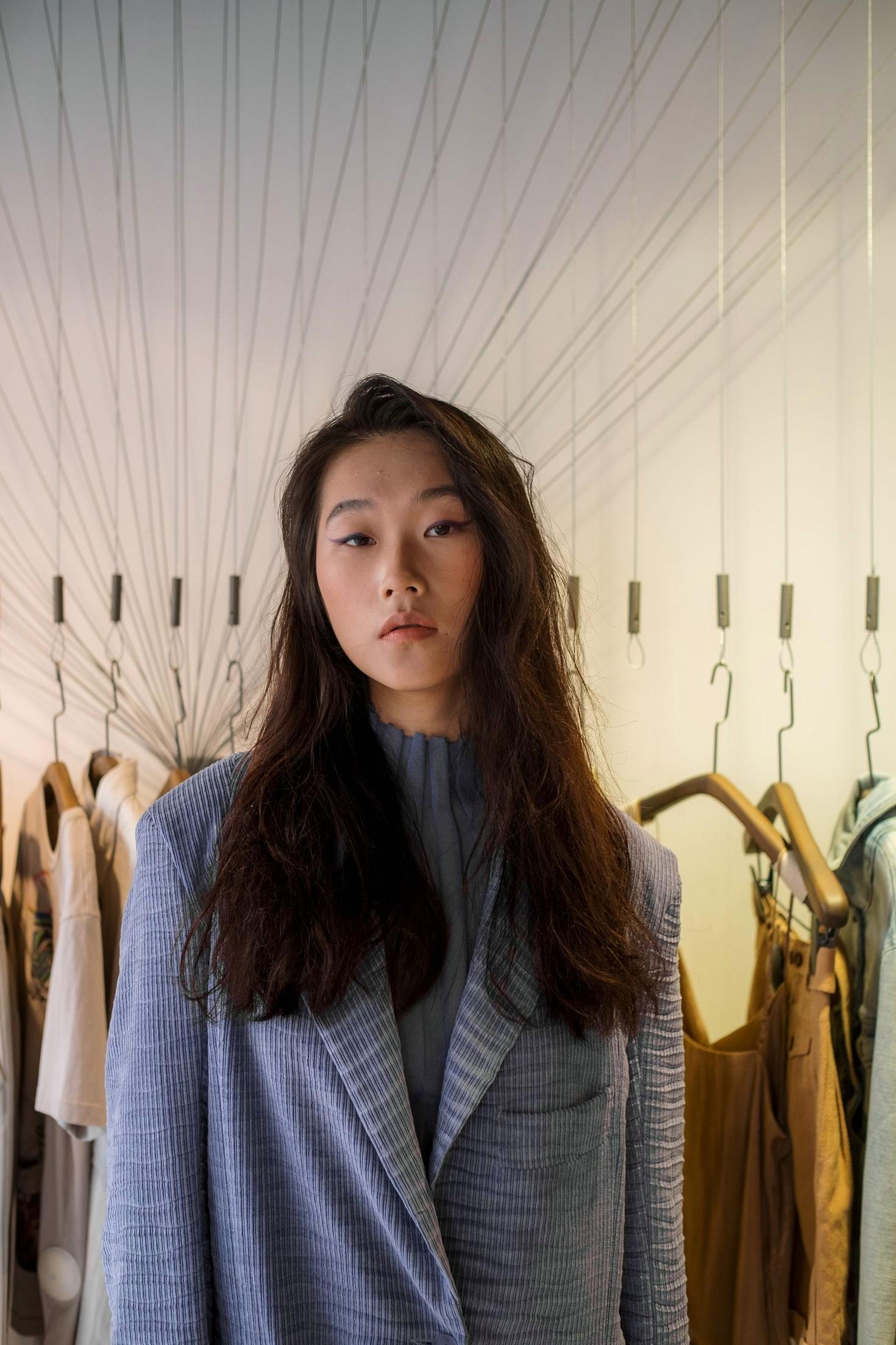 Elegant woman in a fashionable coat, reflecting Offerspark's sophisticated style.